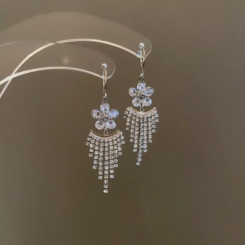 Angled view of the 14K Gold-Plated Elegant Zircon Diamond flower Tassel Earrings