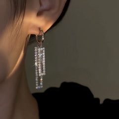 Close-up detail of the sparkling zircons and plating on the Tassel Earrings