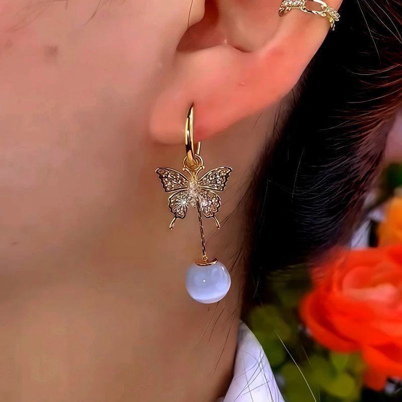 Close-up detail of the sparkling zircons and plating on the Butterfly Cat's Eye Earrings