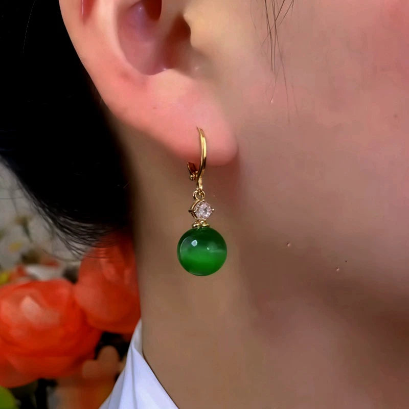 Close-up detail of the sparkling zircons and plating on the Green Cat's Eye Earrings