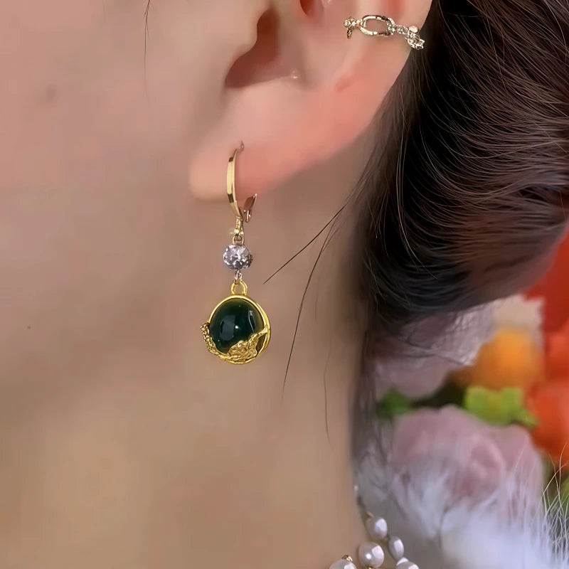 Close-up detail of the sparkling zircons and plating on the Cat Eye Stone Earrings