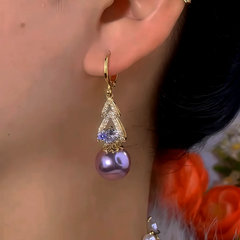 Close-up detail of the sparkling zircons and plating on the Purple Pearl Earrings