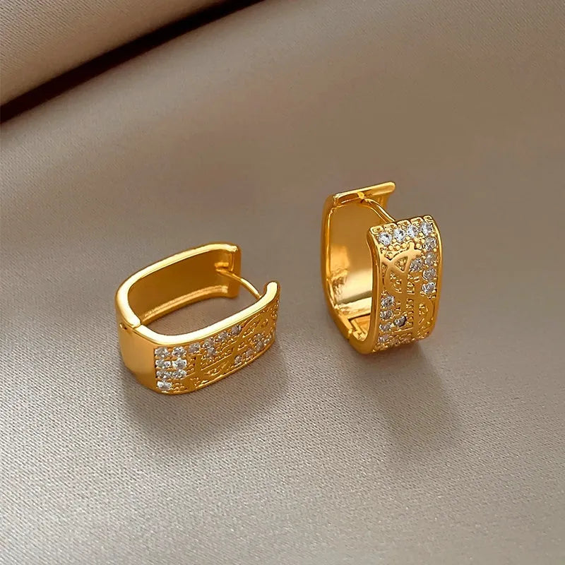 Close-up detail of the sparkling zircons and plating on the Dollar Earrings