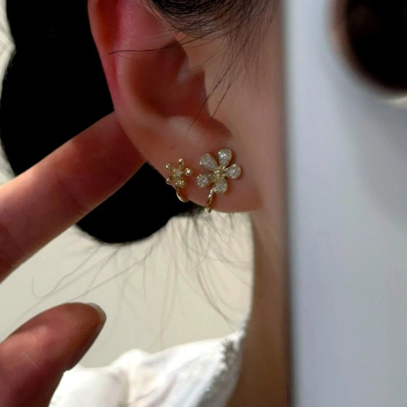 Model showcasing the dangle and style of the 14K Gold-Plated Elegant Zircon Double-Flower Stud Earrings