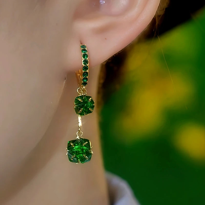 Close-up detail of the sparkling zircons and plating on the Green Ball Earrings