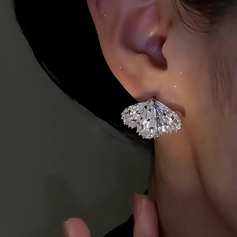 Model showcasing the dangle and style of the 14K Gold-Plated Elegant Zircon Double-Layer Wing Earrings