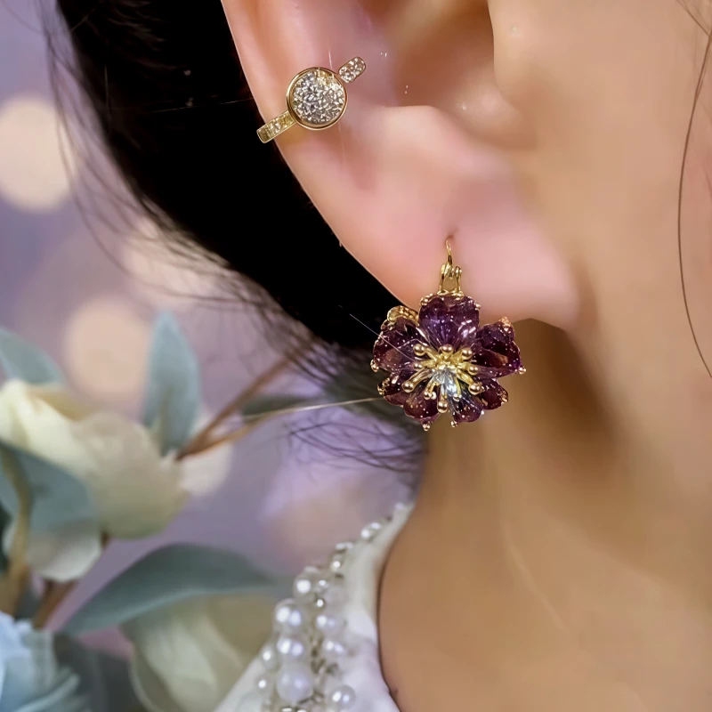 Model showcasing the dangle and style of the 14K Gold-Plated Elegant Zircon Double-Sided Flower Earrings