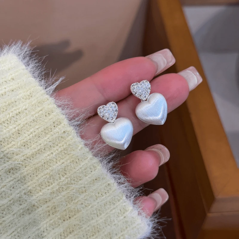 Angled view of the 14K Gold-Plated Elegant Zircon Double Heart Earrings