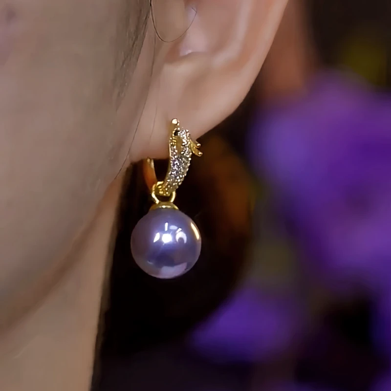 Close-up detail of the sparkling zircons and plating on the Dragon Earrings