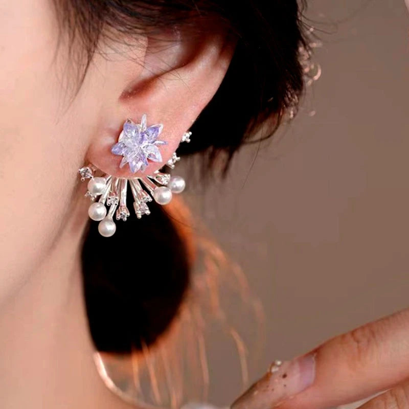 Model showcasing the dangle and style of the 14K Gold-Plated Elegant Zircon Firework Pearl Earrings