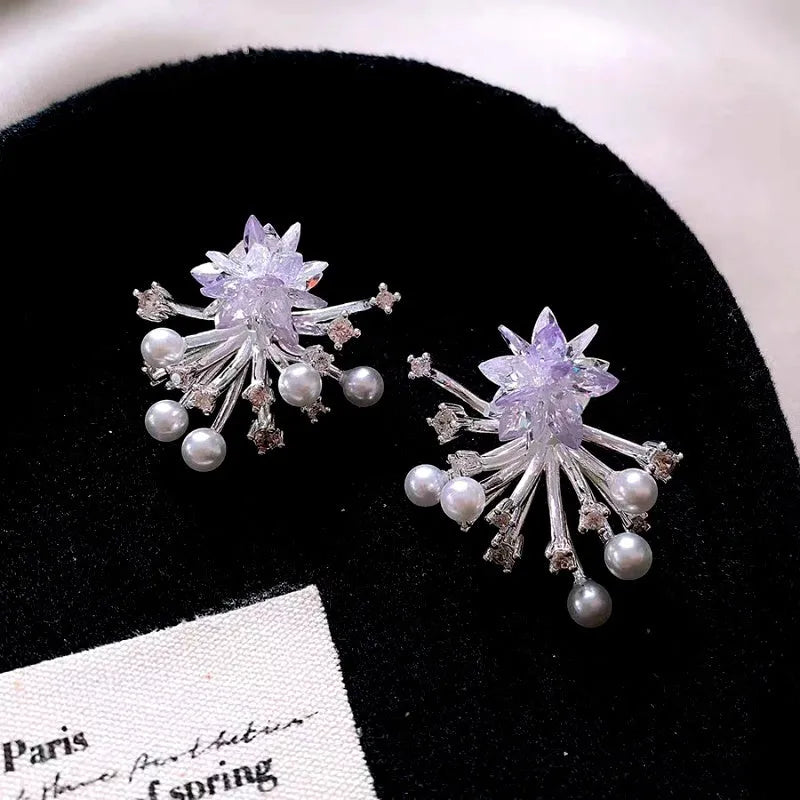 Close-up detail of the sparkling zircons and plating on the Firework Pearl Earrings