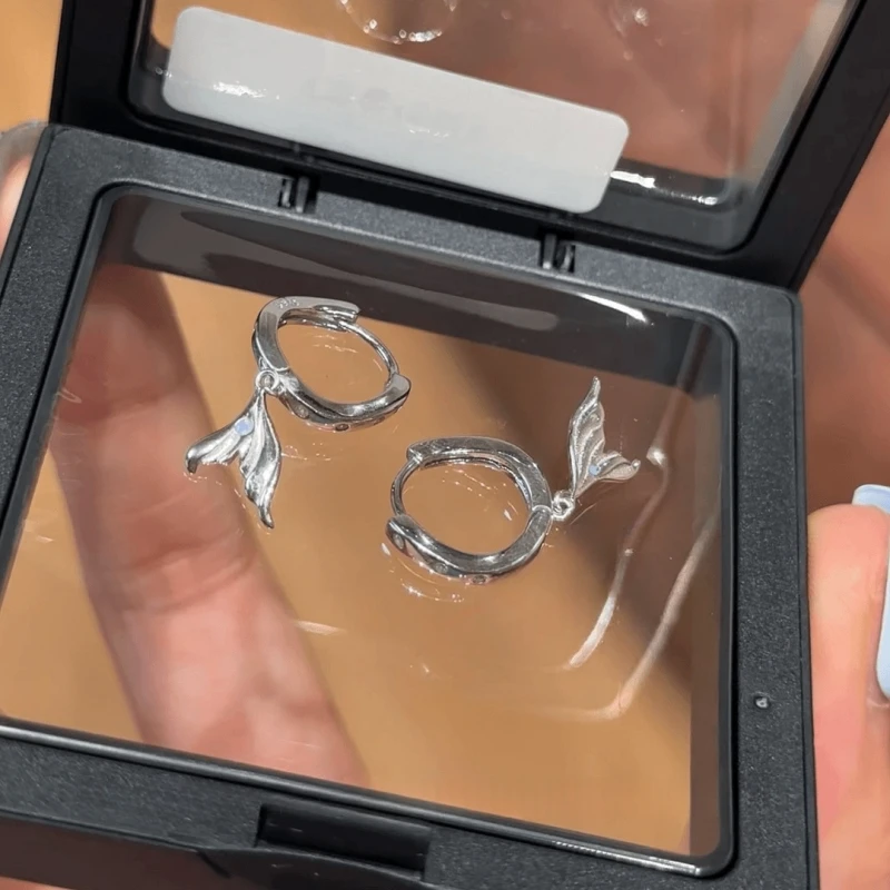 Angled view of the 14K Gold-Plated Elegant Zircon Fishtail Tassel Earrings