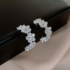 Angled view of the 14K Gold-Plated Elegant Zircon Flower C-Shaped Earrings