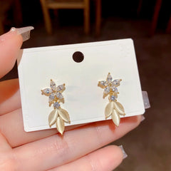Angled view of the 14K Gold-Plated Elegant Zircon Flower Cat's Eye Leaf Earrings