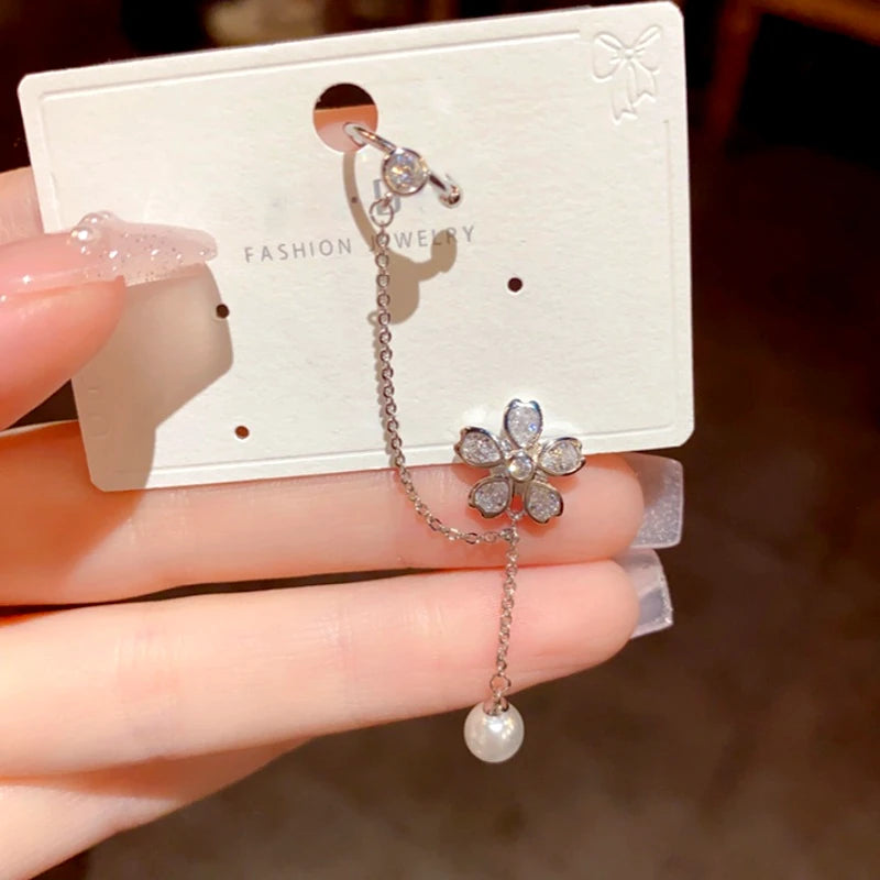 Close-up detail of the sparkling zircons and plating on the Ear Clip Tassel Earrings