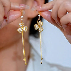 Angled view of the 14K Gold-Plated Elegant Zircon Flower Ear Hook Earrings