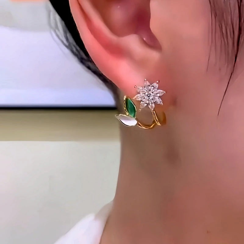 Model showcasing the dangle and style of the 14K Gold-Plated Elegant Zircon Flower Earrings