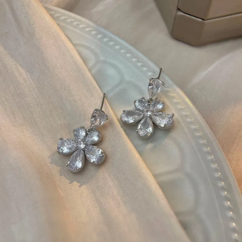 Angled view of the 14K Gold-Plated Elegant Zircon Flower Earrings