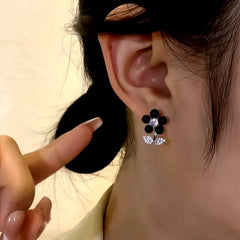 Close-up detail of the sparkling zircons and plating on the Black Flower Earrings