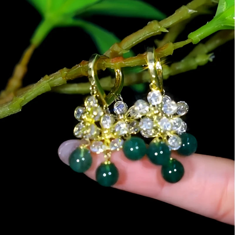Angled view of the 14K Gold-Plated Elegant Zircon Flower Green Bead Tassel Earrings
