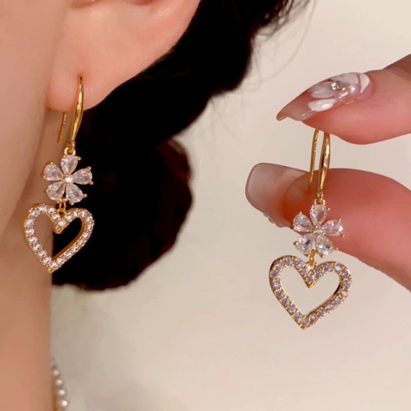 Close-up detail of the sparkling zircons and plating on the gold threader earrings