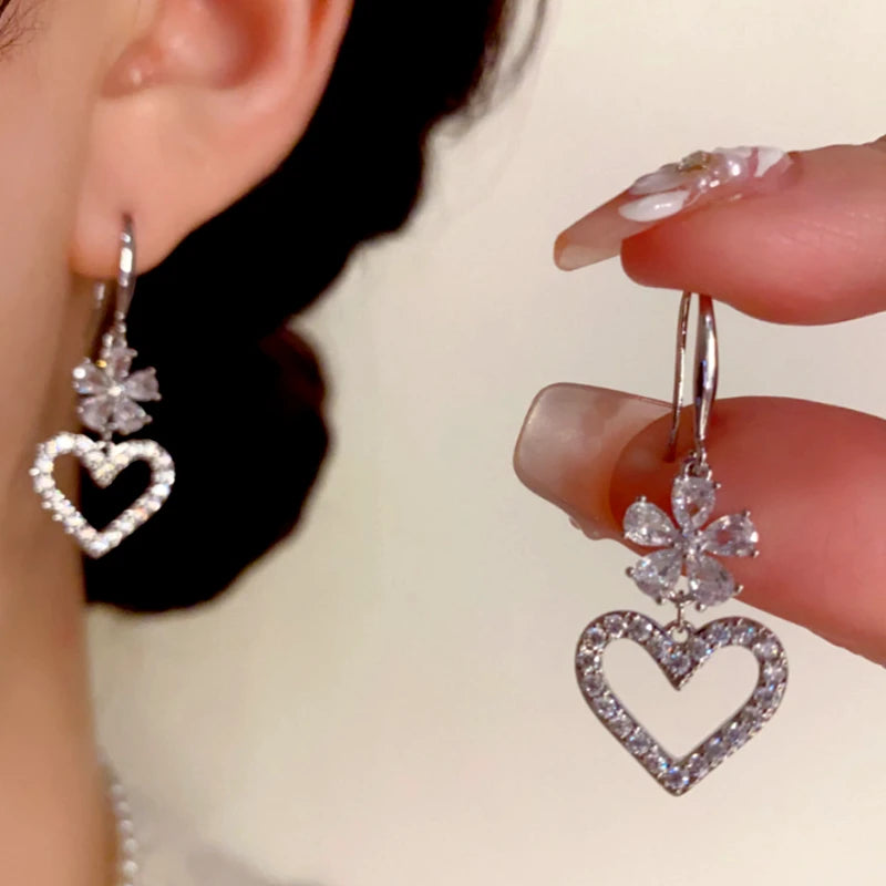 Angled view of the 14K Gold-Plated Elegant Zircon Flower Heart Ear Hooks