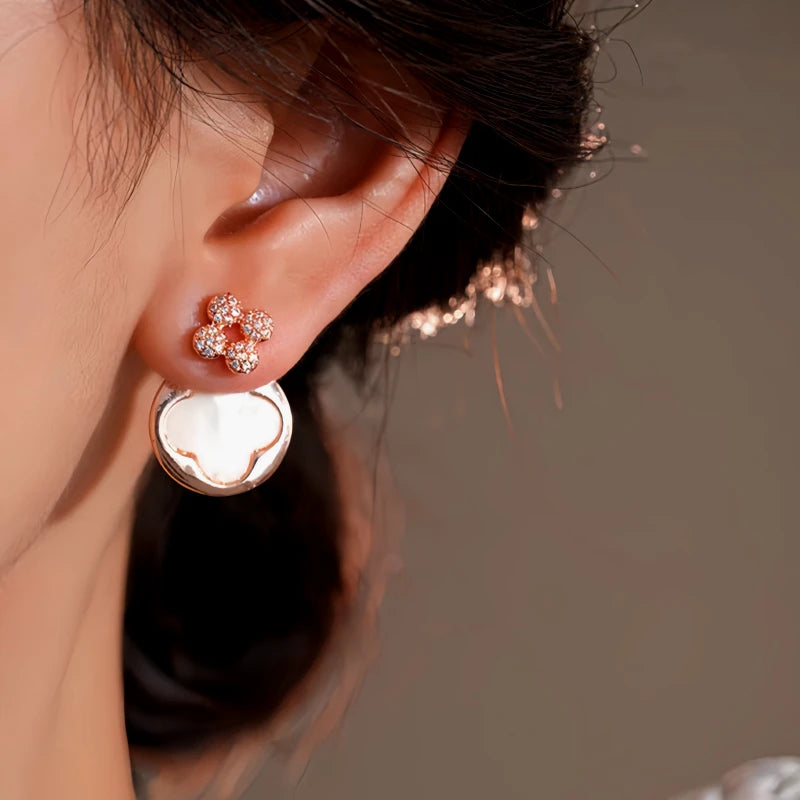 Model showcasing the dangle and style of the 14K Gold-Plated Elegant Zircon Flower Jacket Earrings