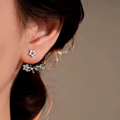 Model showcasing the dangle and style of the 14K Gold-Plated Elegant Zircon Flower Jacket Earrings