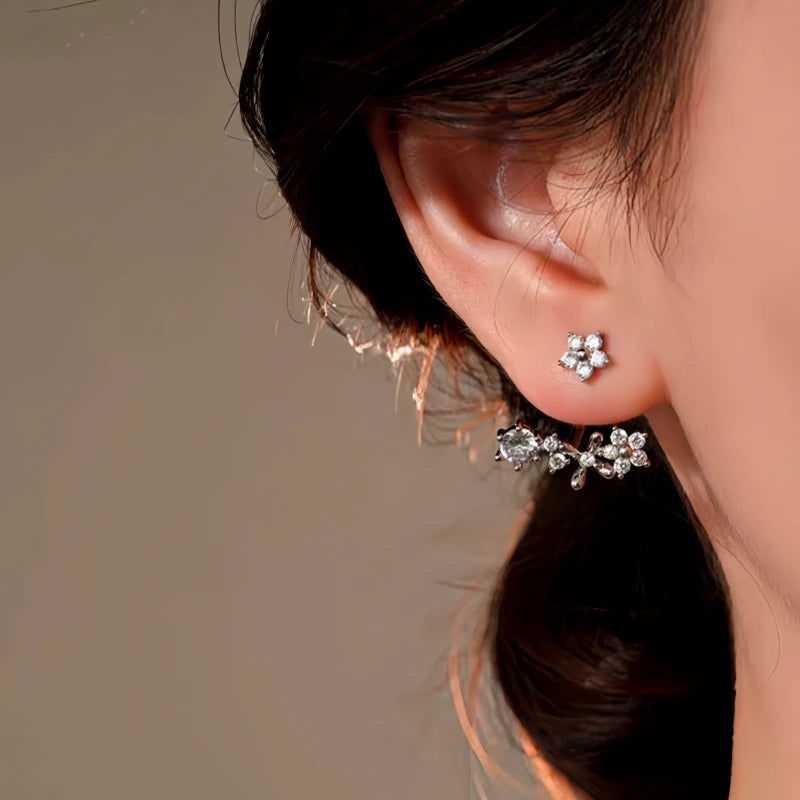 Close-up detail of the sparkling zircons and plating on the gold flower earrings