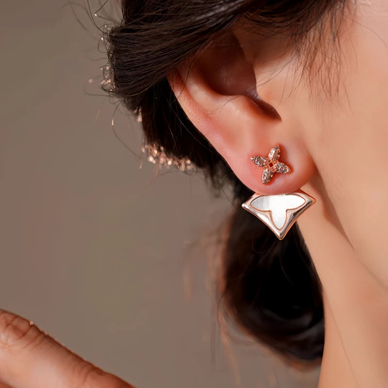 Close-up detail of the sparkling zircons and plating on the rose gold earrings