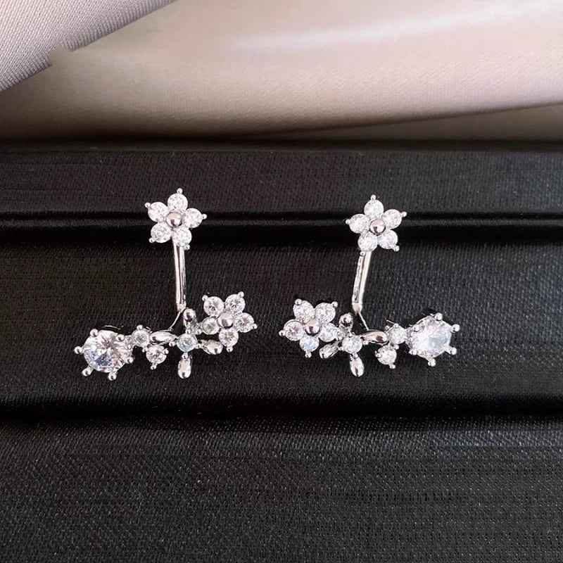 Angled view of the 14K Gold-Plated Elegant Zircon Flower Jacket Earrings