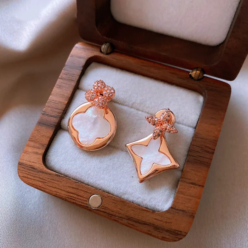 Angled view of the 14K Gold-Plated Elegant Zircon Flower Jacket Earrings