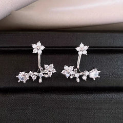 Angled view of the 14K Gold-Plated Elegant Zircon Flower Jacket Earrings