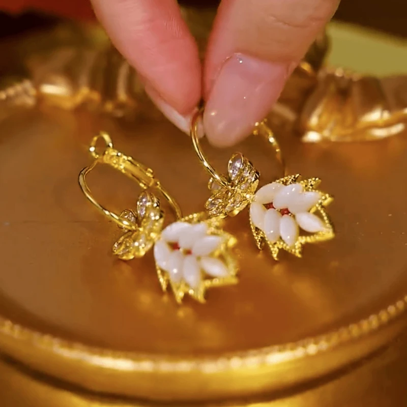 Angled view of the 14K Gold-Plated Elegant Zircon Flower Leaf Tassel Earrings