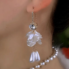 Model showcasing the dangle and style of the 14K Gold-Plated Elegant Zircon Flower Pearl Ear Hooks