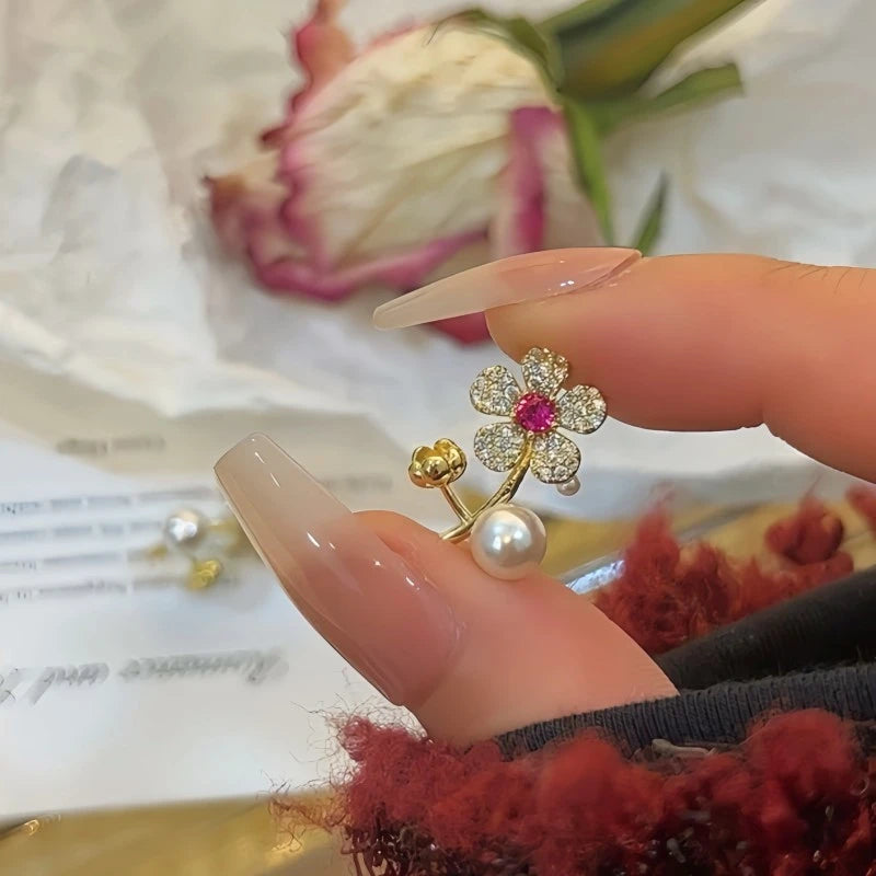 Angled view of the 14K Gold-Plated Elegant Zircon Flower Pearl Earrings