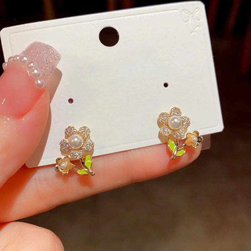 Angled view of the 14K Gold-Plated Elegant Zircon Flower Pearl Stud Earrings