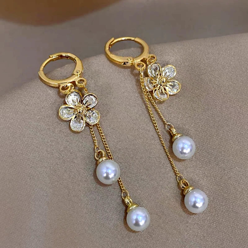 Angled view of the 14K Gold-Plated Elegant Zircon Flower Pearl Tassel Earrings