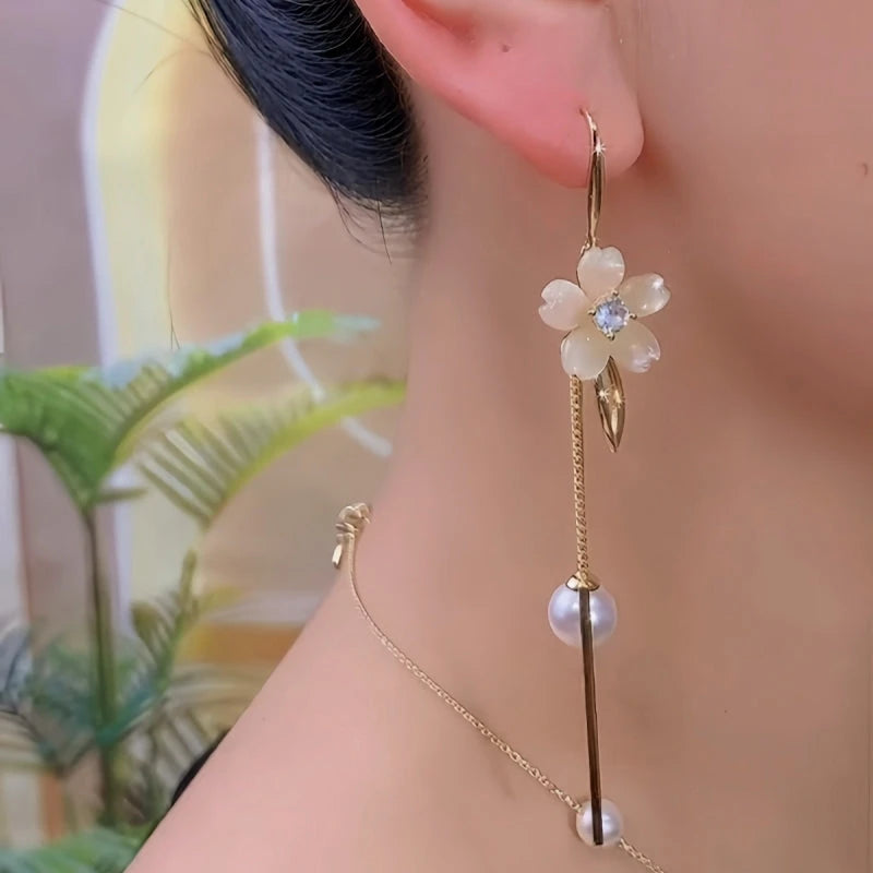 Angled view of the 14K Gold-Plated Elegant Zircon Flower Pearl Tassel Earrings