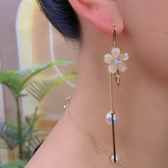 Angled view of the 14K Gold-Plated Elegant Zircon Flower Pearl Tassel Earrings