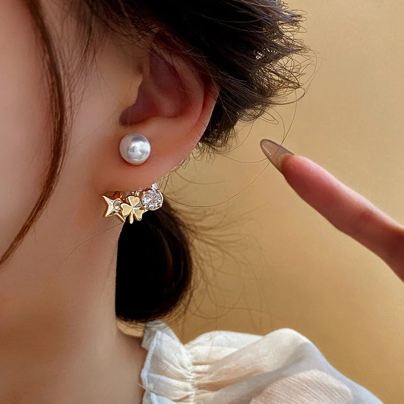 Model showcasing the dangle and style of the 14K Gold-Plated Elegant Zircon Flower Star Pearl Earrings