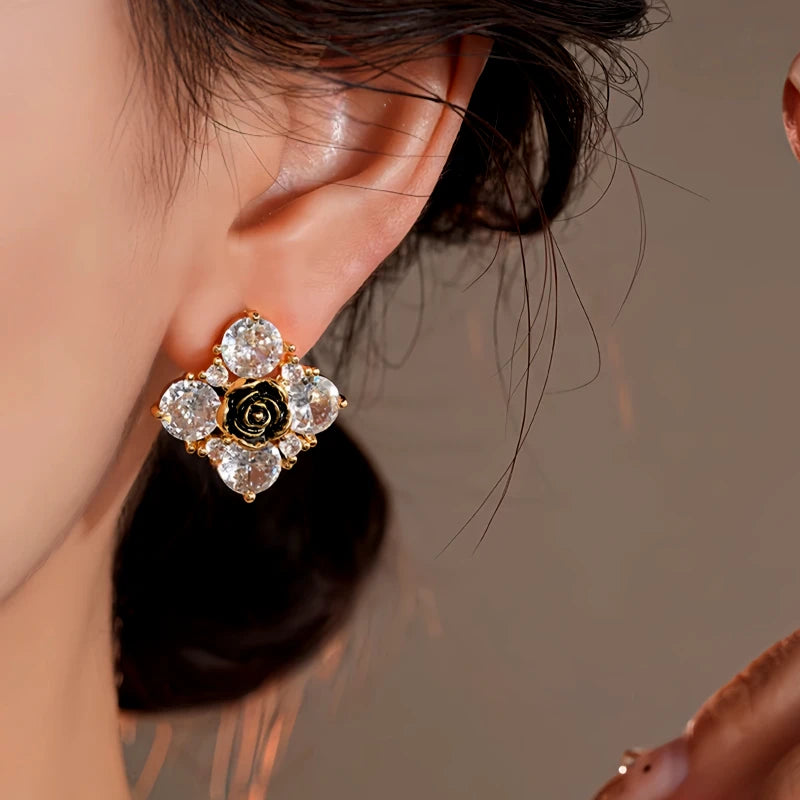 Close-up detail of the sparkling zircons and plating on the gold flower earrings