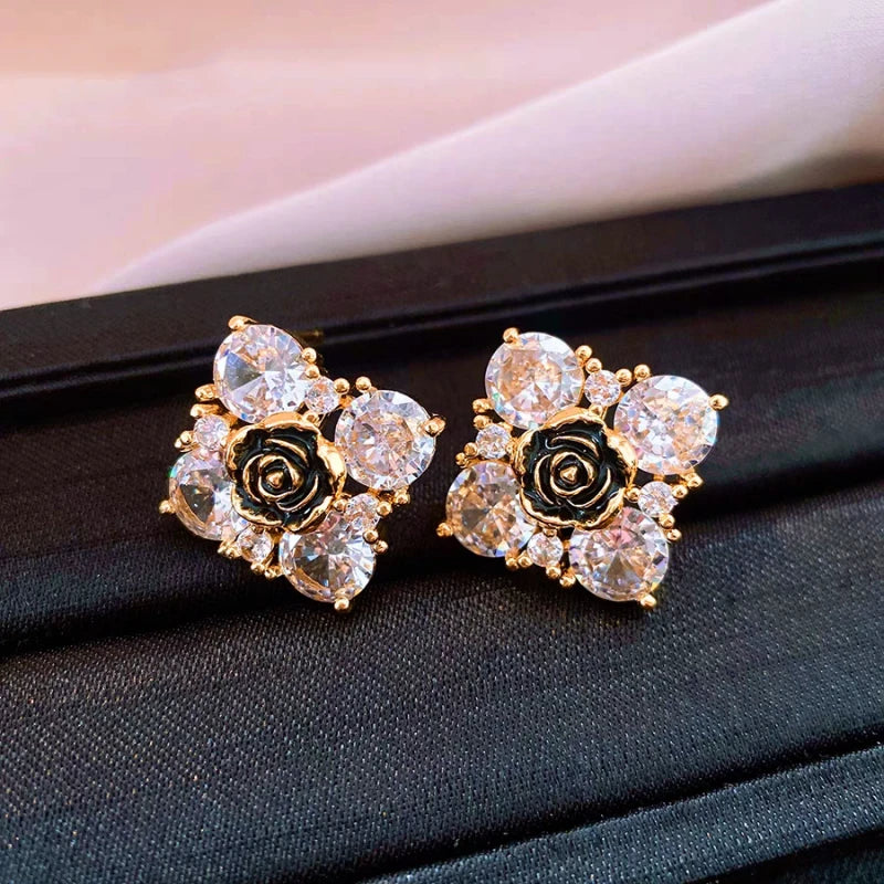 Angled view of the 14K Gold-Plated Elegant Zircon Flower Stud Earrings