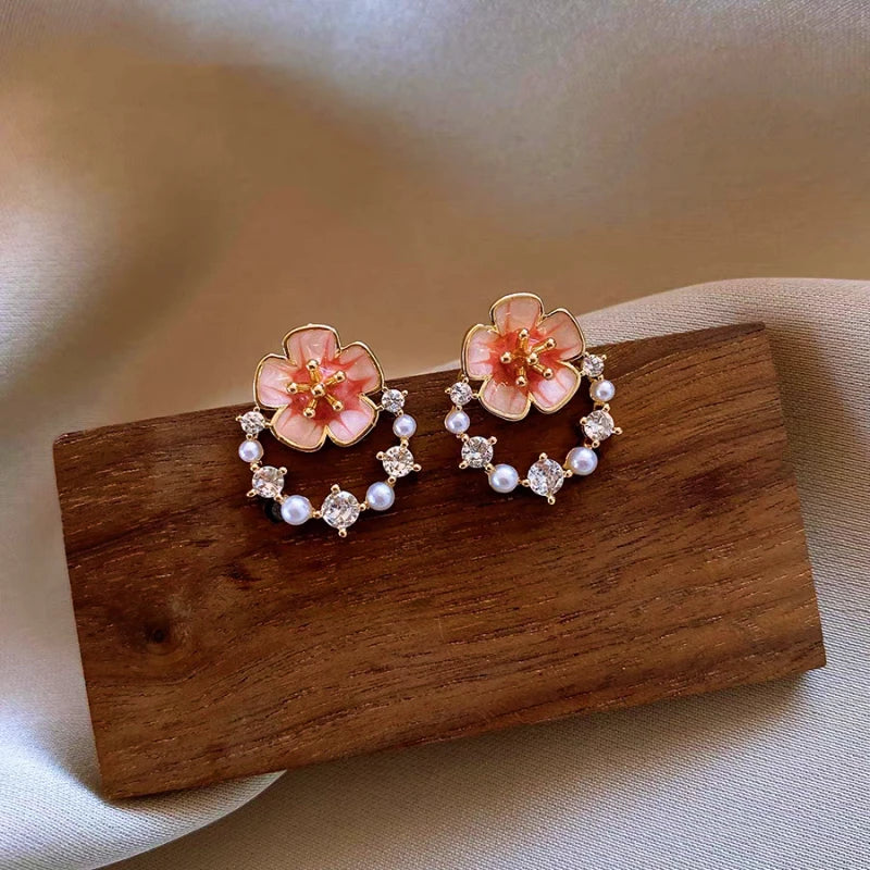 Angled view of the 14K Gold-Plated Elegant Zircon Flower Stud Earrings