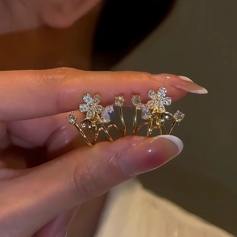 Model showcasing the dangle and style of the 14K Gold-Plated Elegant Zircon Flower Studs