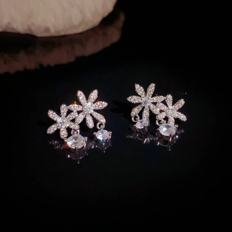 Angled view of the 14K Gold-Plated Elegant Zircon Flower Tassel Earrings