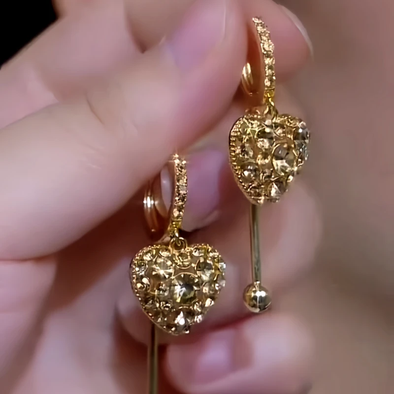 Angled view of the 14K Gold-Plated Elegant Zircon Full Diamond Heart Earrings