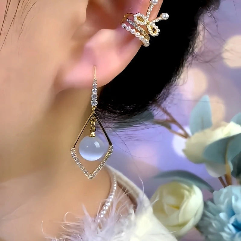 Close-up detail of the sparkling zircons and plating on the gold threader earrings