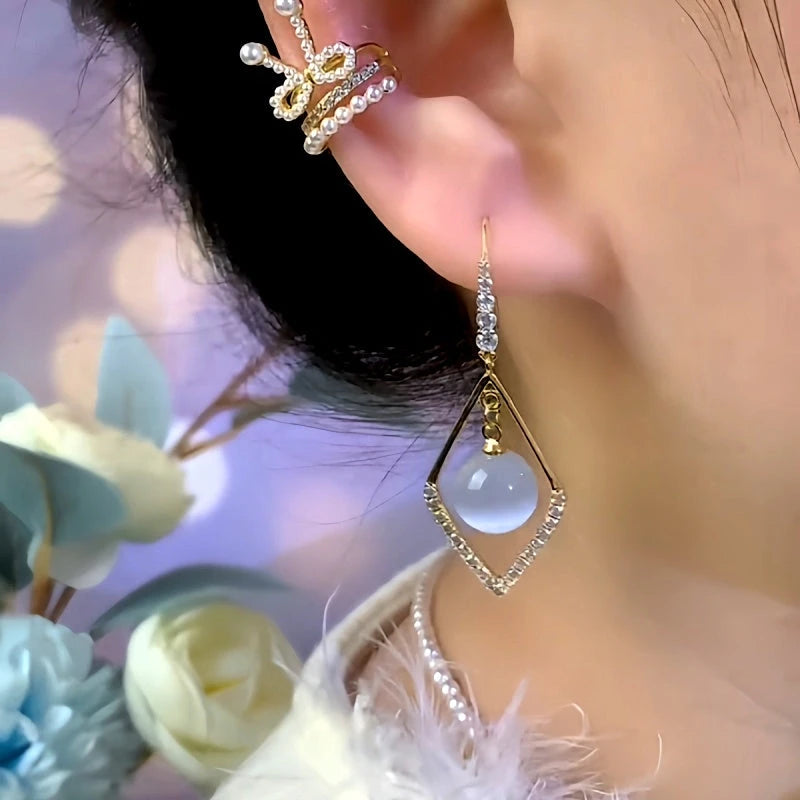 Model showcasing the dangle and style of the 14K Gold-Plated Elegant Zircon Geometric Bead Ear Hook Earrings