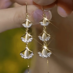 Angled view of the 14K Gold-Plated Elegant Zircon Ginkgo Leaf Threader Earrings